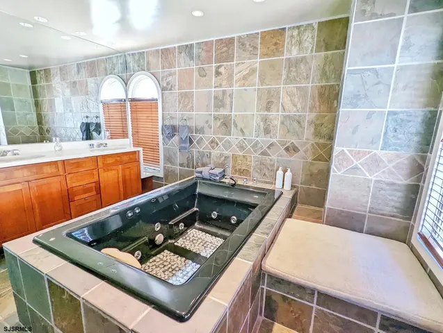 a bedroom with a bed and a television