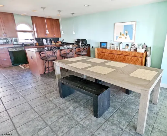 a view of a kitchen with a sink and a stove