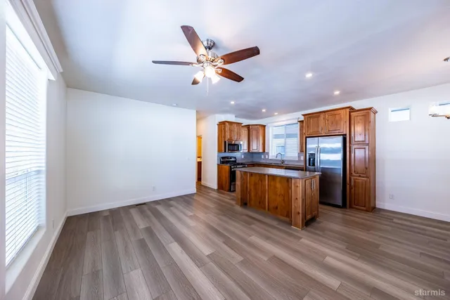 a view of kitchen and wooden floor