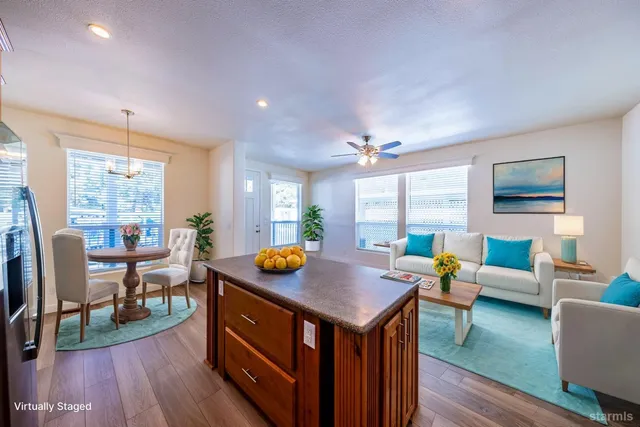 a view of livingroom with dining room and wooden floor