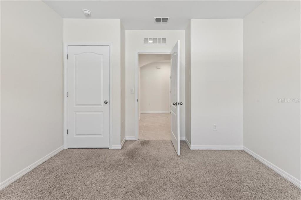 205 Old Mill Pond Road Palm Harbor, FL 34683 - Photo 13 of 57 an empty room with a bathroom and a sink
