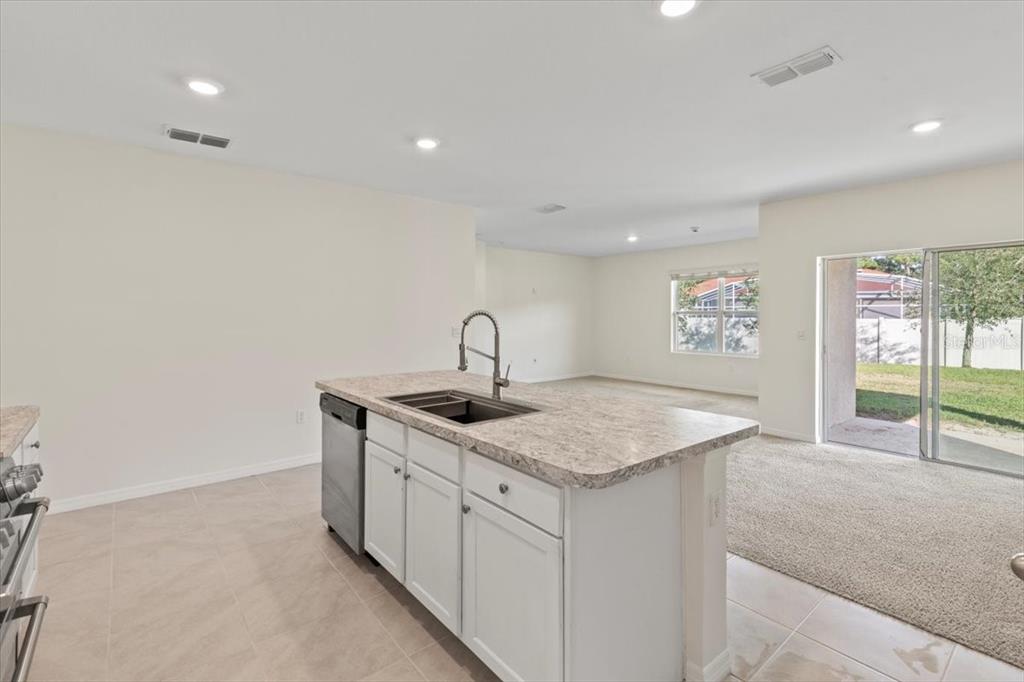 205 Old Mill Pond Road Palm Harbor, FL 34683 - Photo 22 of 57 a kitchen with a sink and a window