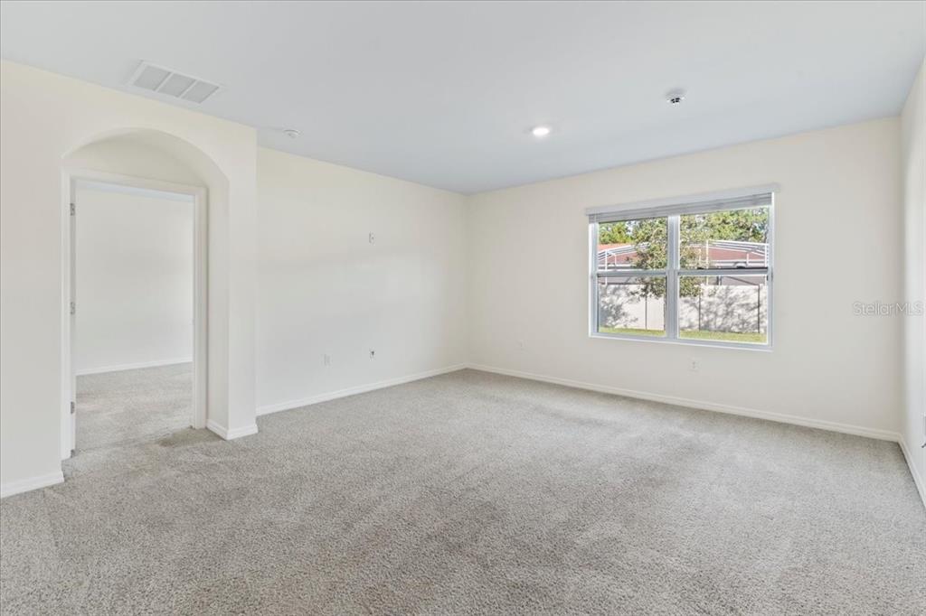 205 Old Mill Pond Road Palm Harbor, FL 34683 - Photo 24 of 57 an empty room with a window