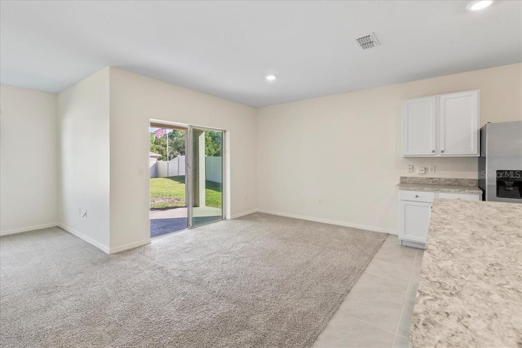 205 Old Mill Pond Road Palm Harbor, FL 34683 - Photo 25 of 57 a view of a kitchen with a sink and a window