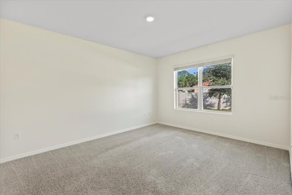 205 Old Mill Pond Road Palm Harbor, FL 34683 - Photo 27 of 57 an empty room with windows