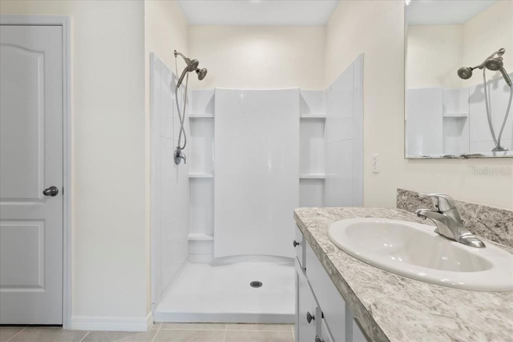 205 Old Mill Pond Road Palm Harbor, FL 34683 - Photo 32 of 57 a bathroom with a sink a toilet and shower