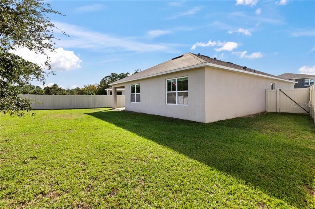 205 Old Mill Pond Road Palm Harbor, FL 34683 - Photo 42 of 57 a view of a backyard with a garden
