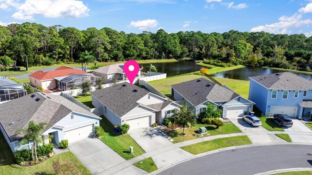 205 Old Mill Pond Road Palm Harbor, FL 34683 - Photo 48 of 57 an aerial view of a house with a garden and swimming pool