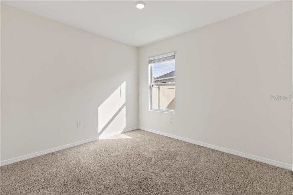205 Old Mill Pond Road Palm Harbor, FL 34683 - Photo 9 of 57 a view of an empty room with a window
