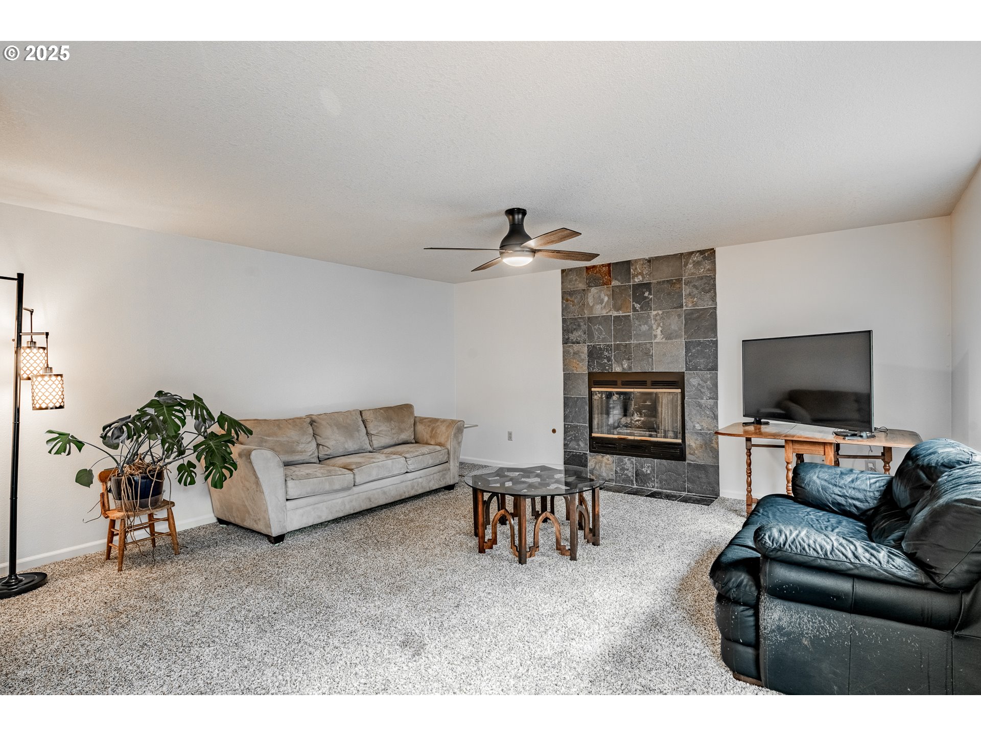 4043 Southeast Harmony Place Camas, WA 98607 - Photo 14 of 40 a living room with furniture and a flat screen tv