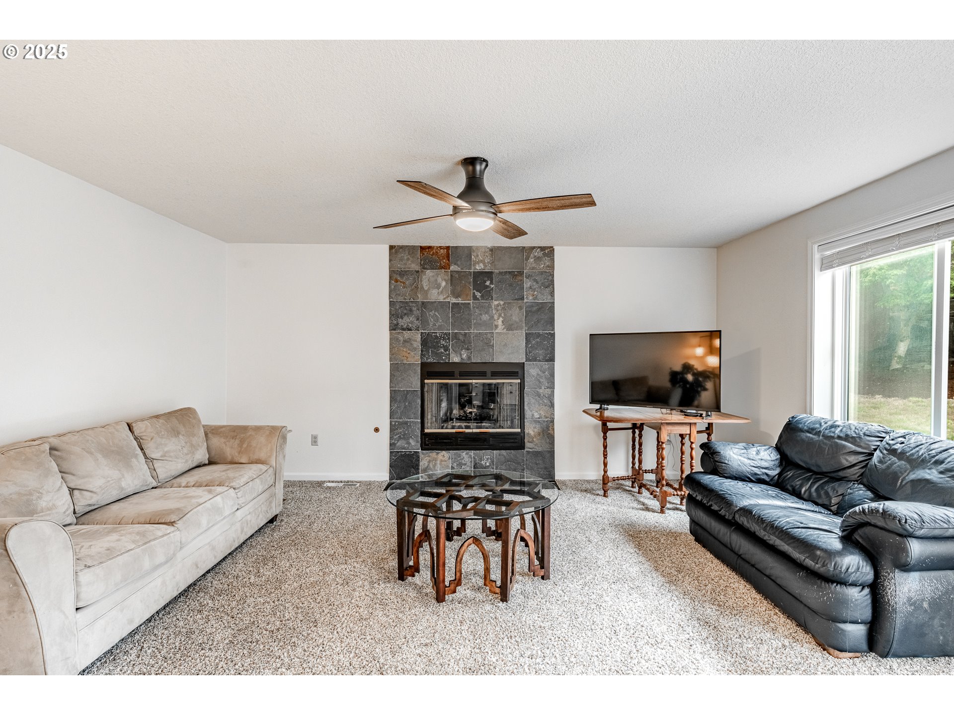 4043 Southeast Harmony Place Camas, WA 98607 - Photo 15 of 40 a living room with furniture and a flat screen tv