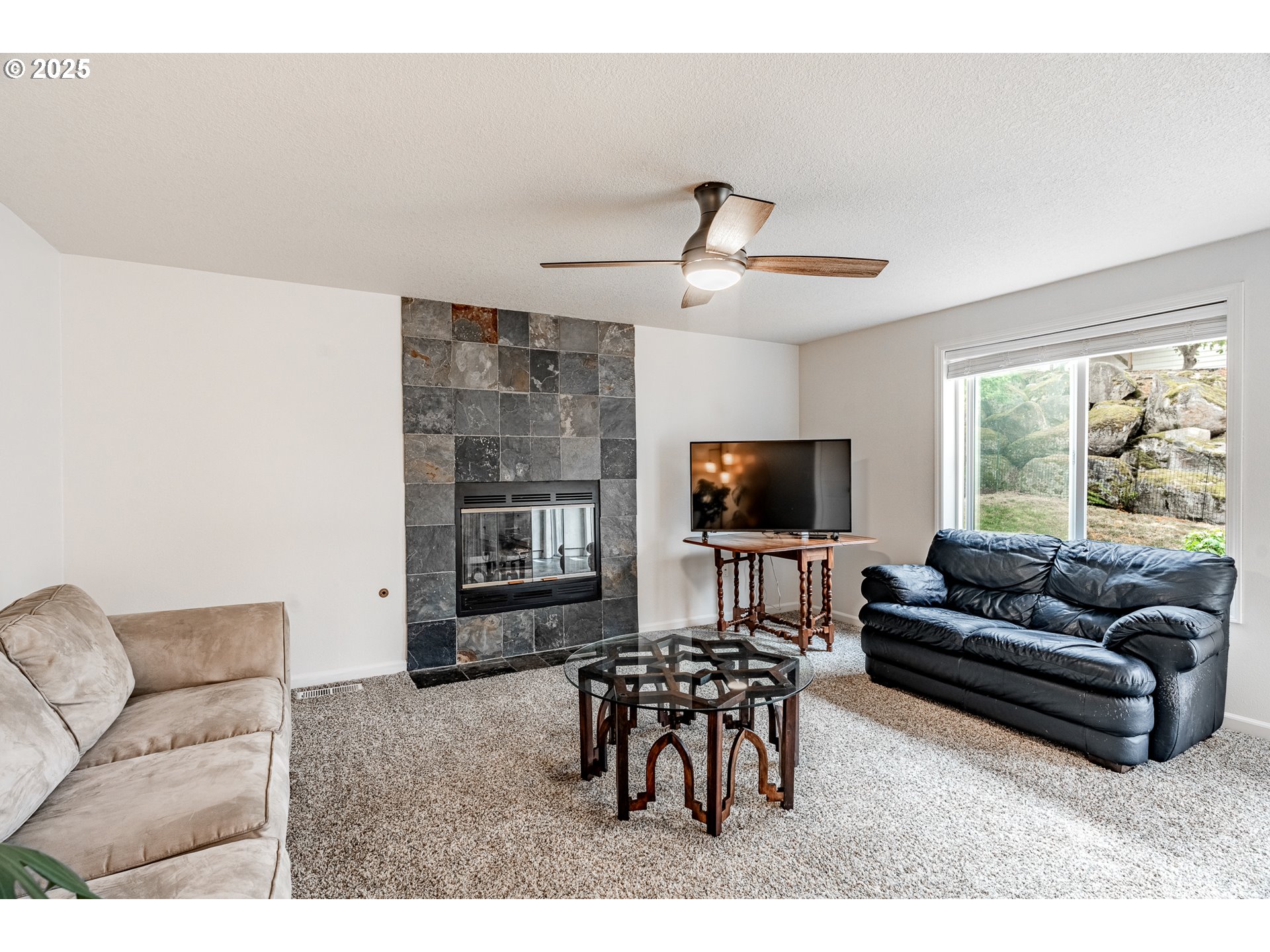 4043 Southeast Harmony Place Camas, WA 98607 - Photo 16 of 40 a living room with furniture and a flat screen tv