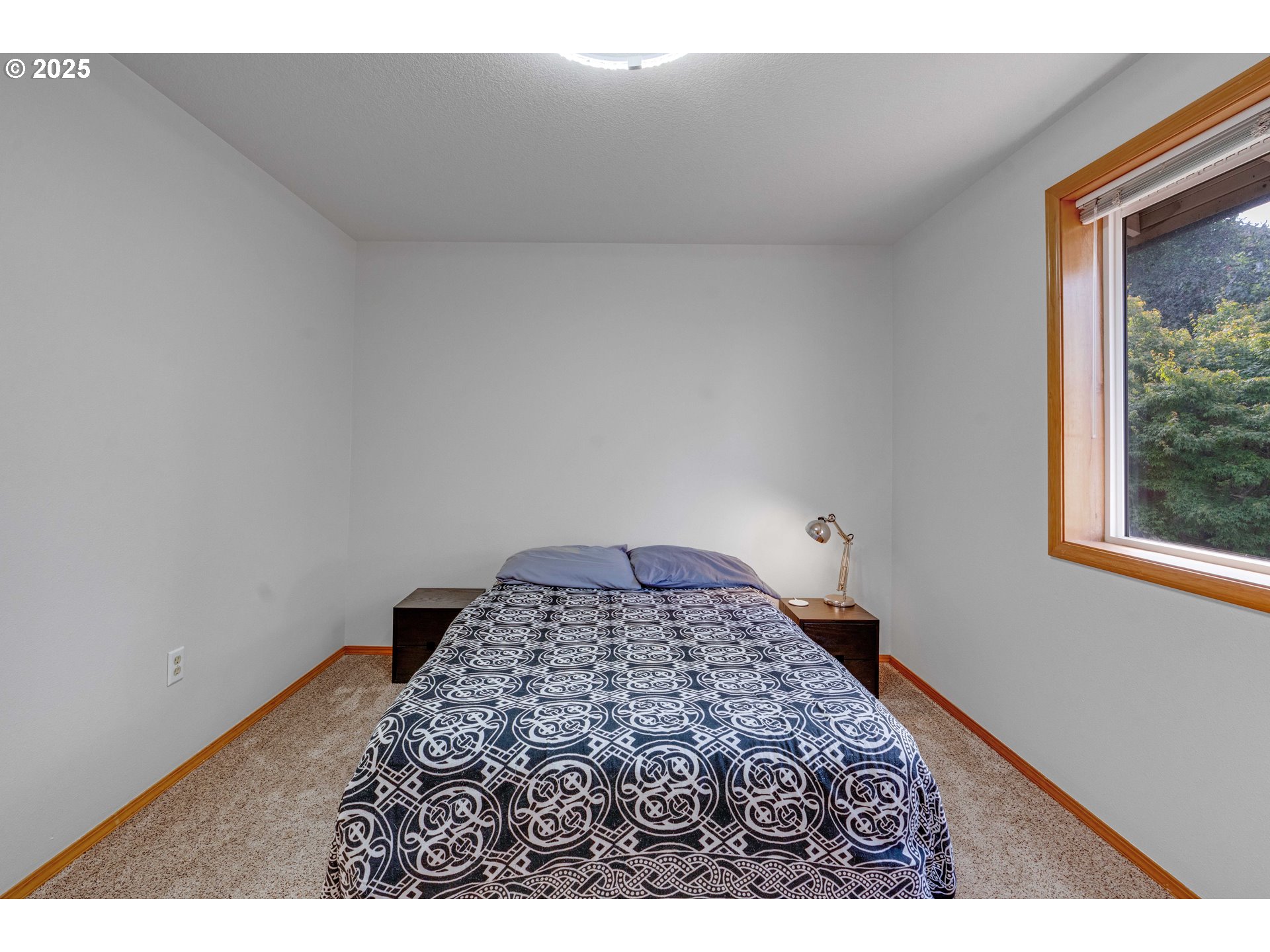 4043 Southeast Harmony Place Camas, WA 98607 - Photo 18 of 40 a bedroom with a bed and a window