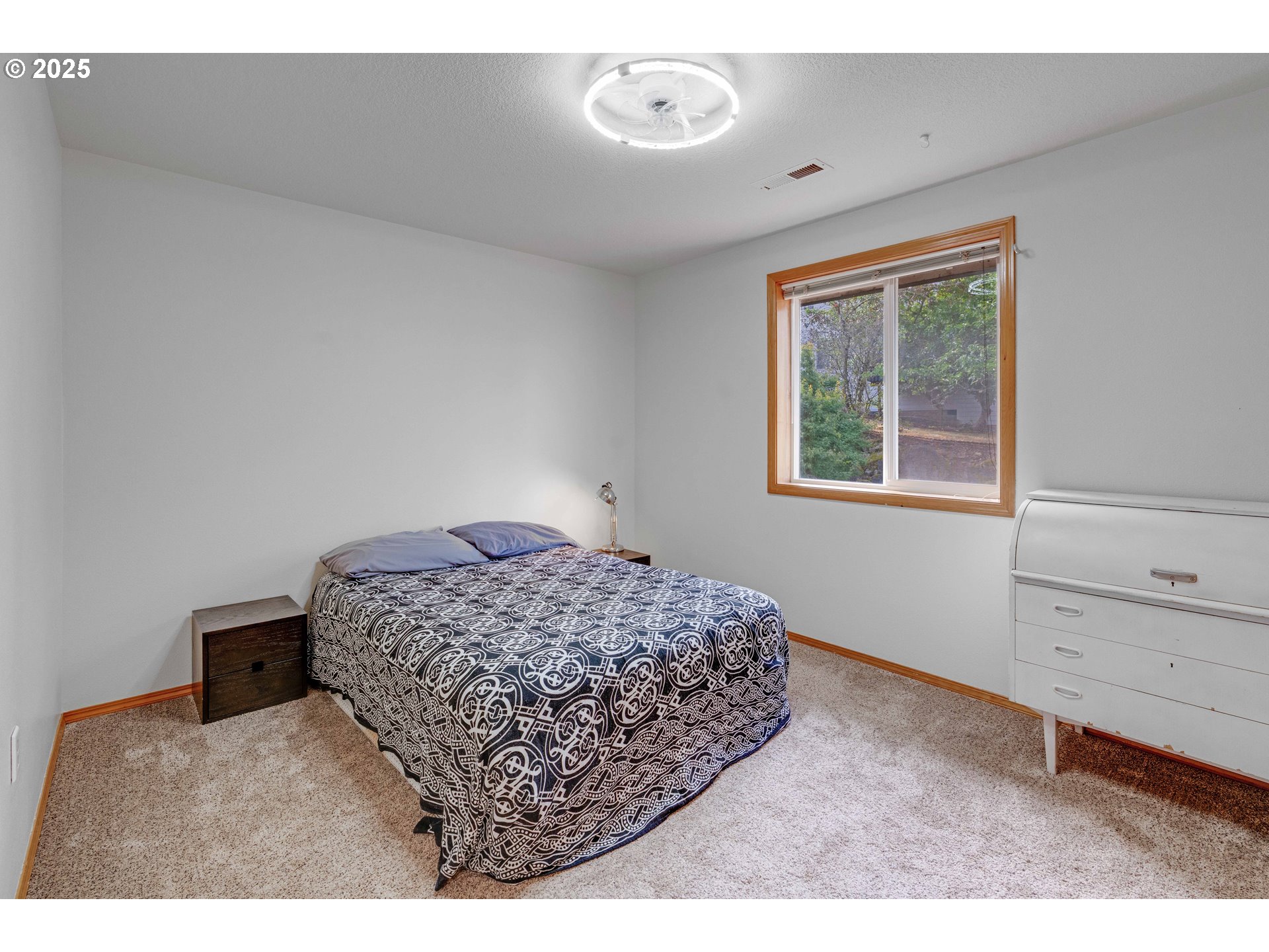 4043 Southeast Harmony Place Camas, WA 98607 - Photo 19 of 40 a bedroom with a bed and a window