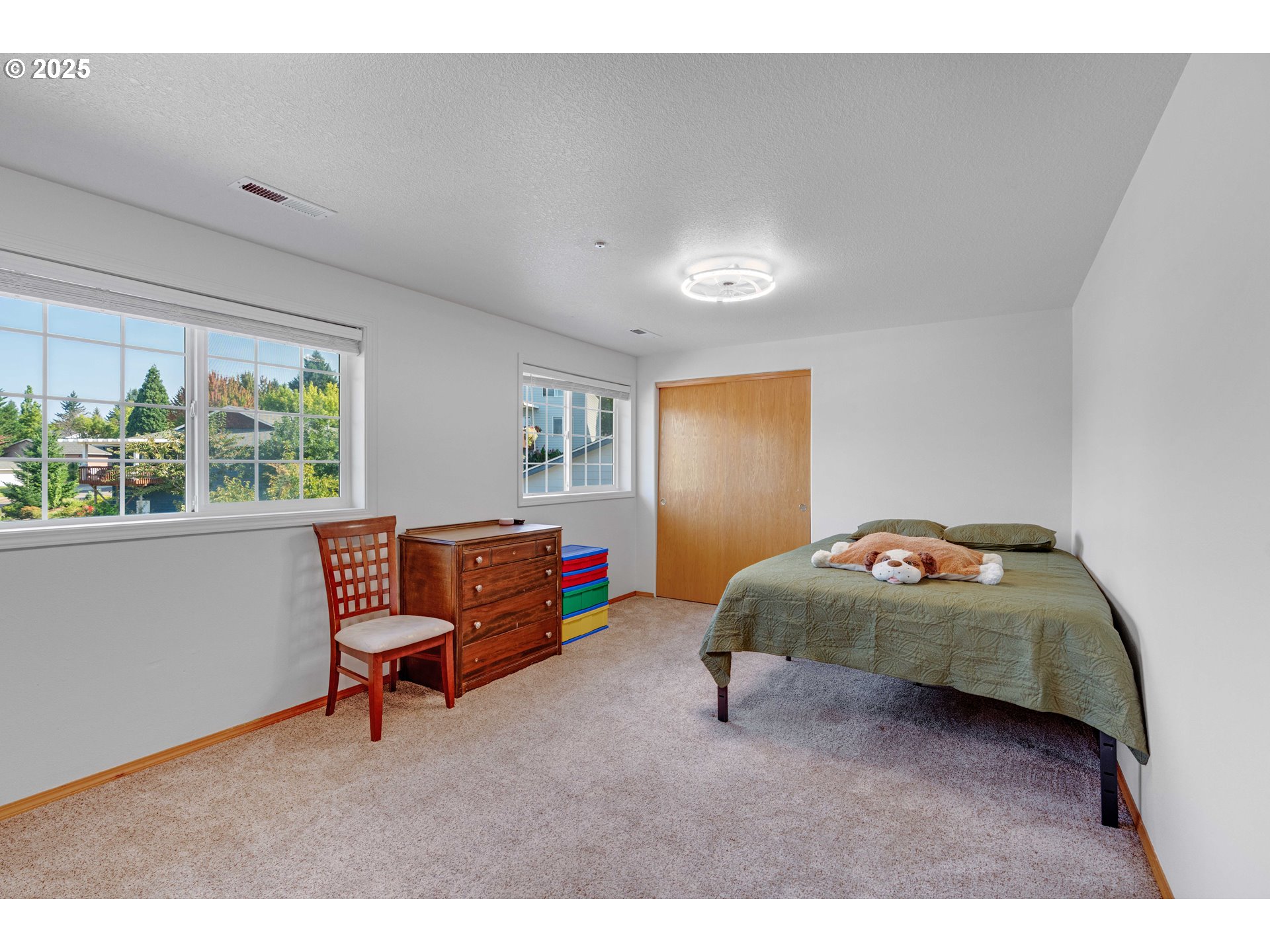 4043 Southeast Harmony Place Camas, WA 98607 - Photo 20 of 40 a bedroom with a bed and a window