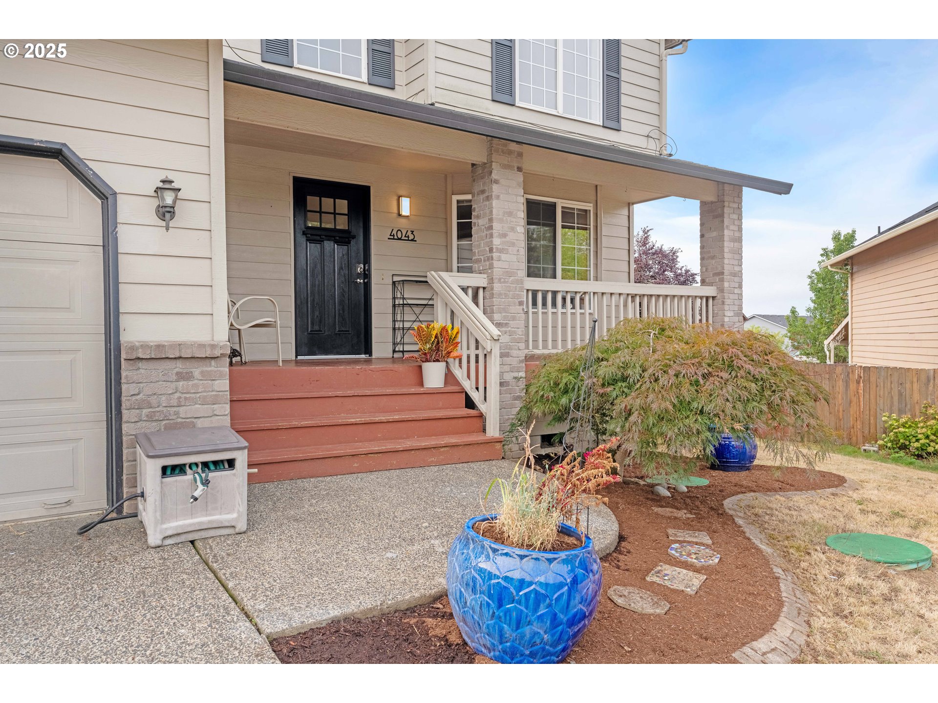 4043 Southeast Harmony Place Camas, WA 98607 - Photo 2 of 40 a front view of a house with porch
