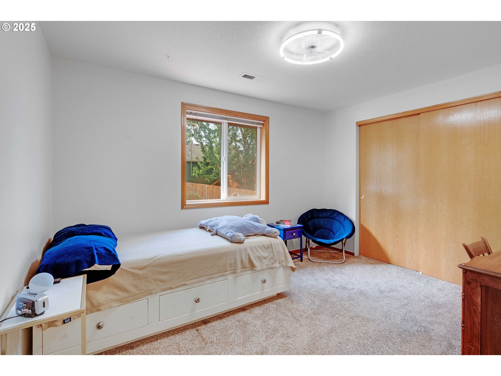 4043 Southeast Harmony Place Camas, WA 98607 - Photo 22 of 40 a bedroom with a bed and window