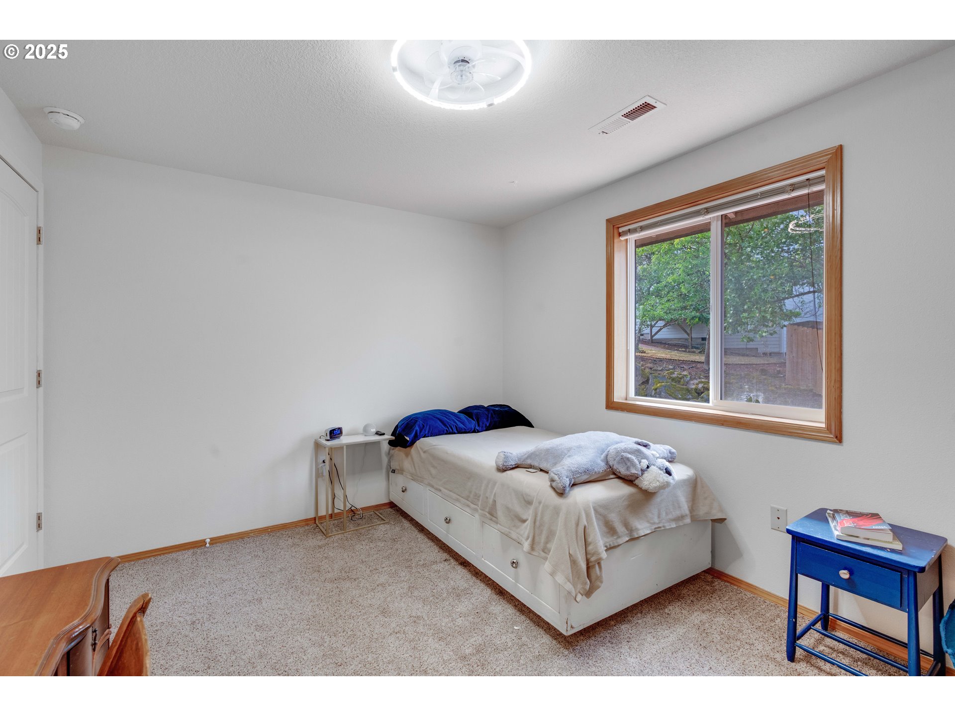 4043 Southeast Harmony Place Camas, WA 98607 - Photo 23 of 40 a bedroom with a bed and a window