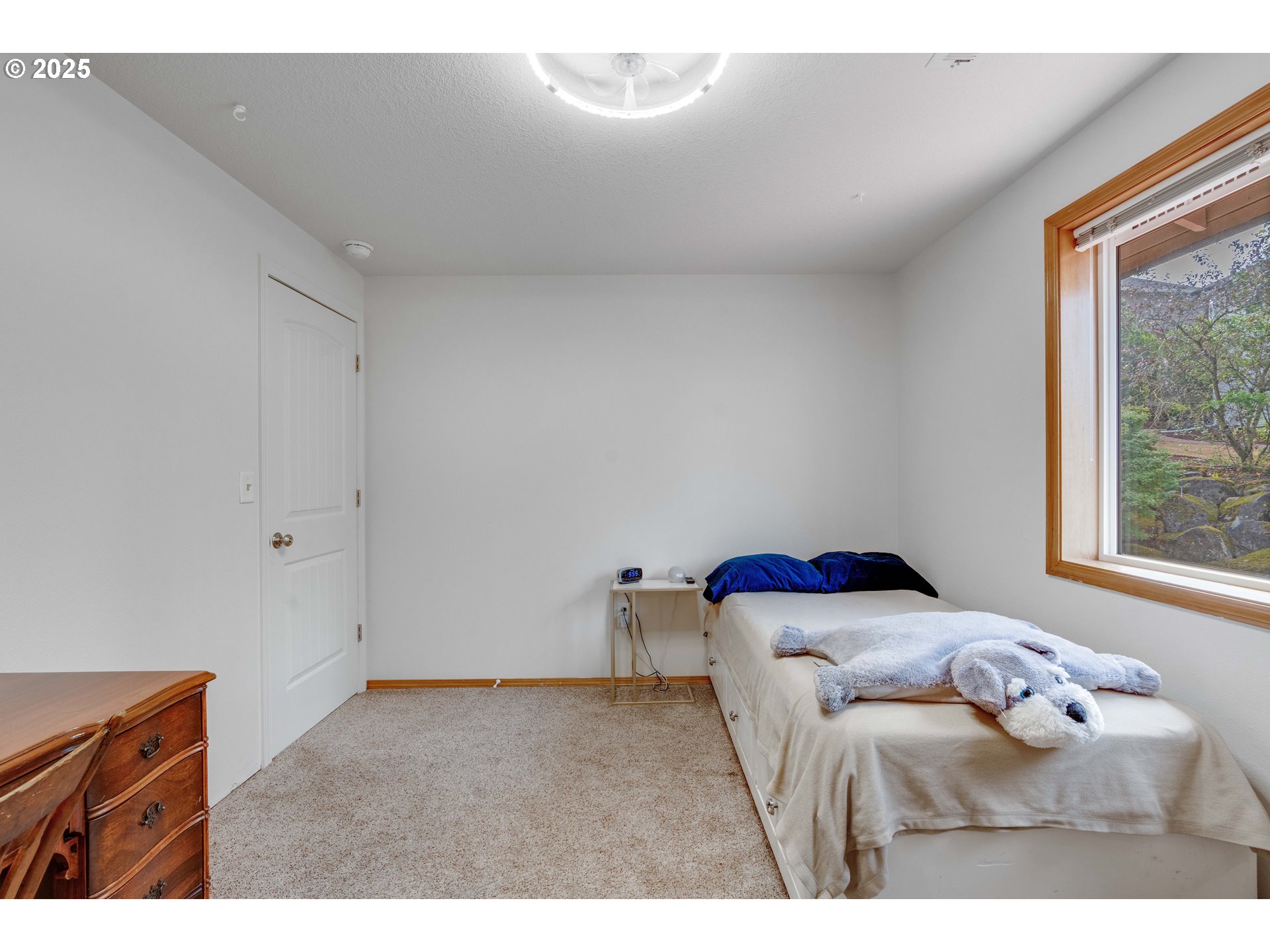 4043 Southeast Harmony Place Camas, WA 98607 - Photo 24 of 40 a bedroom with a bed and window