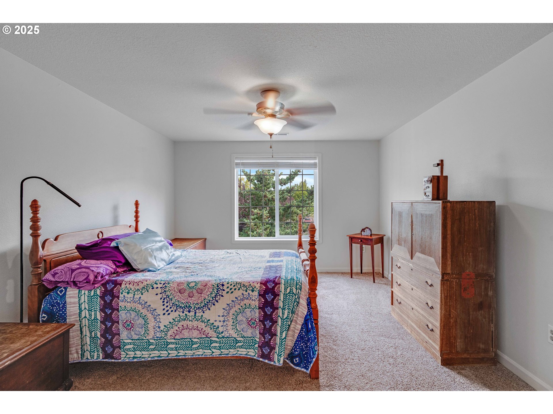 4043 Southeast Harmony Place Camas, WA 98607 - Photo 26 of 40 a bedroom with furniture and a chandelier