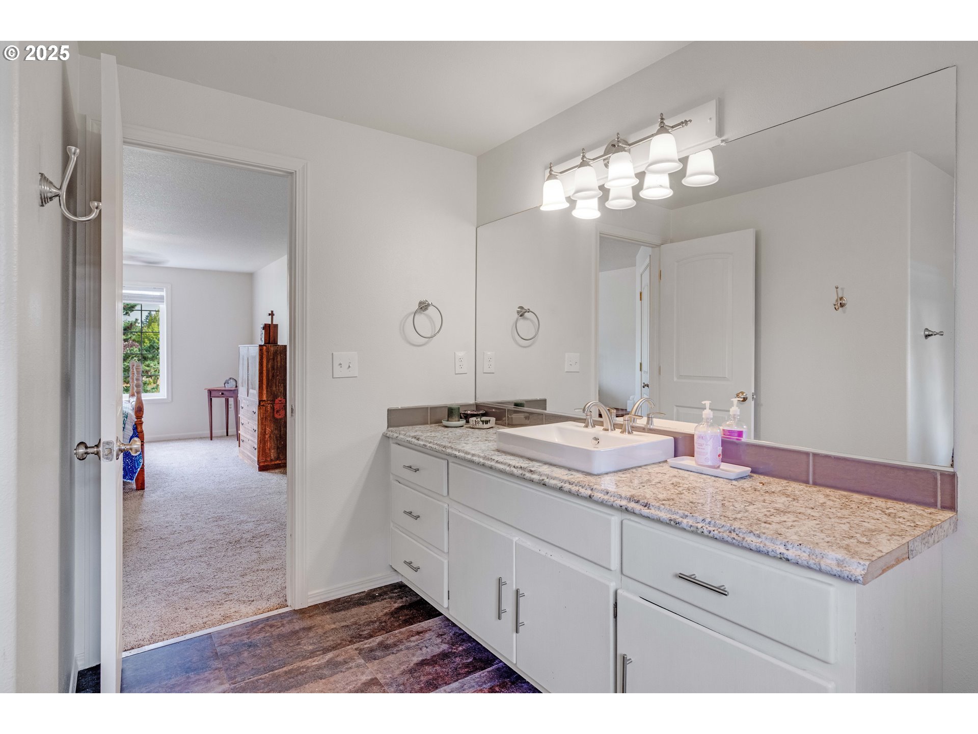 4043 Southeast Harmony Place Camas, WA 98607 - Photo 29 of 40 a bathroom with a granite countertop sink and a mirror