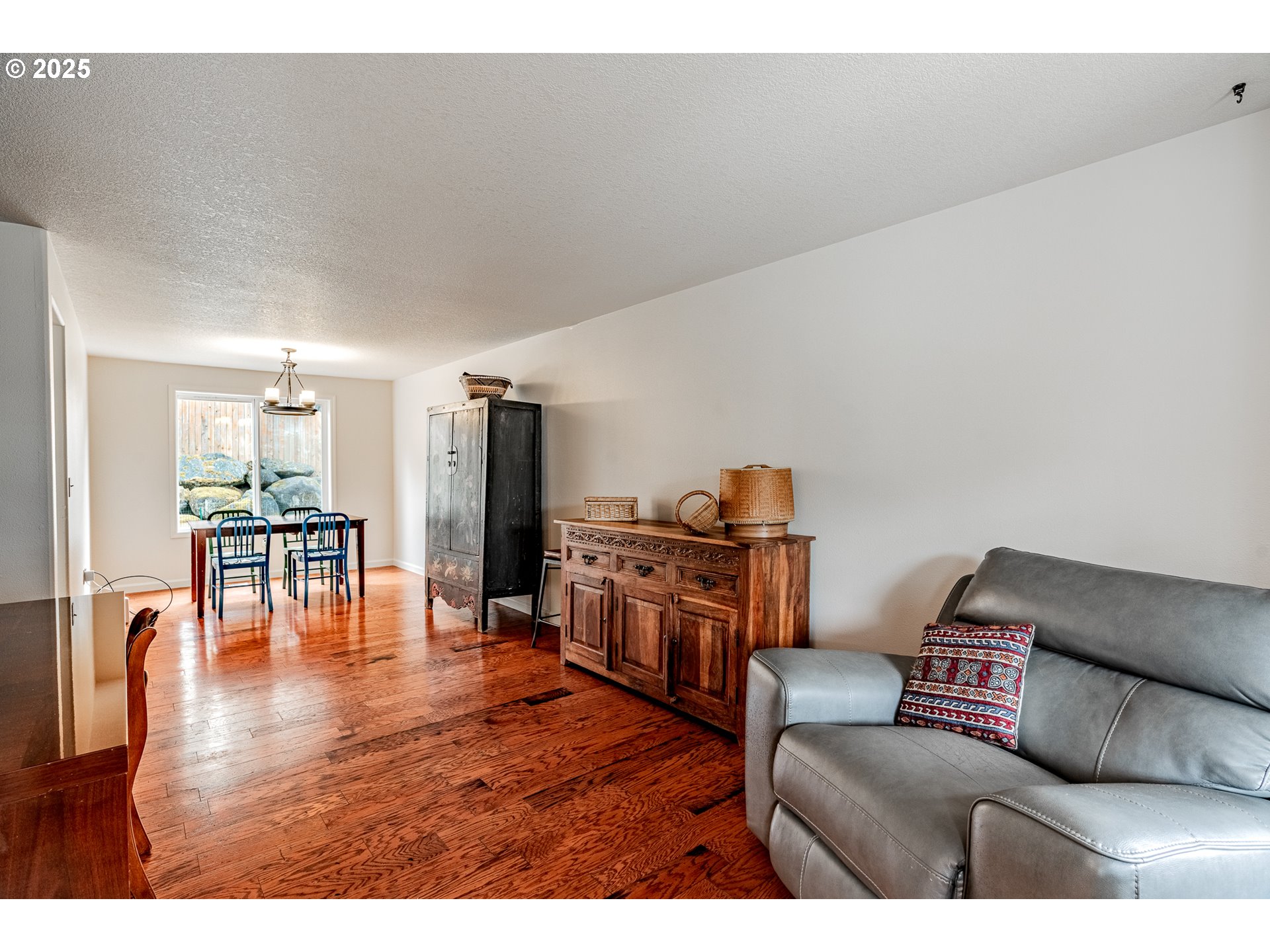 4043 Southeast Harmony Place Camas, WA 98607 - Photo 3 of 40 a living room with furniture and a table with wooden floor