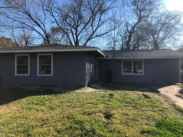 a house with trees in front of it