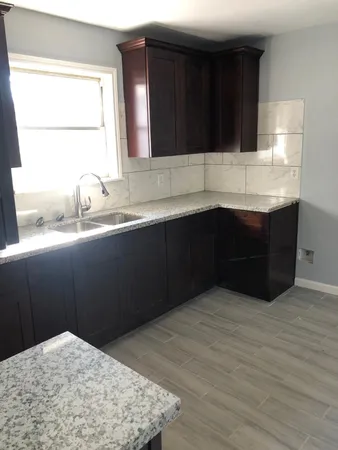 a kitchen with a sink and a window
