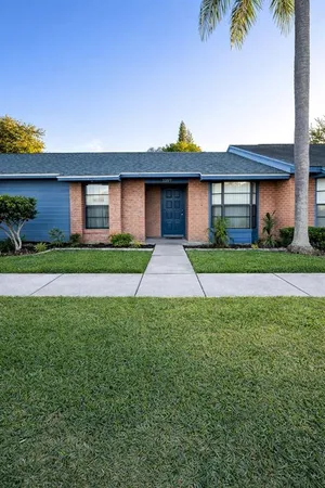 a front view of a house with garden