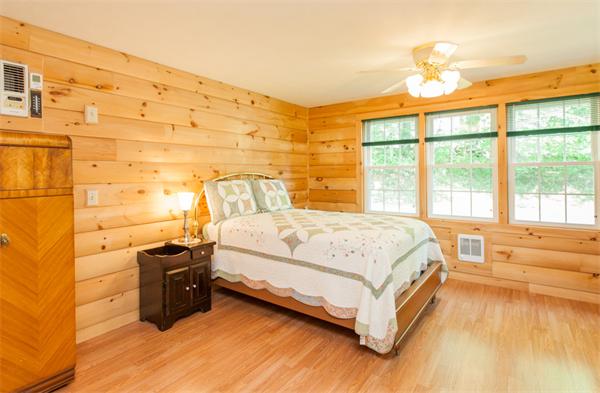 224 Munn Road Monson, MA 01057 - Photo 18 of 30 a spacious bedroom with a bed and a large window
