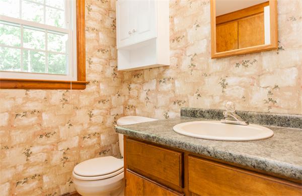 224 Munn Road Monson, MA 01057 - Photo 21 of 30 a bathroom with a granite countertop sink toilet and mirror