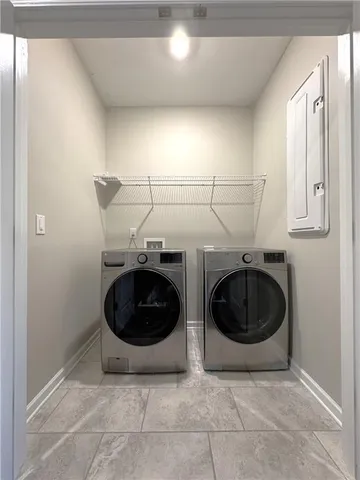 a utility room with dryer and washer