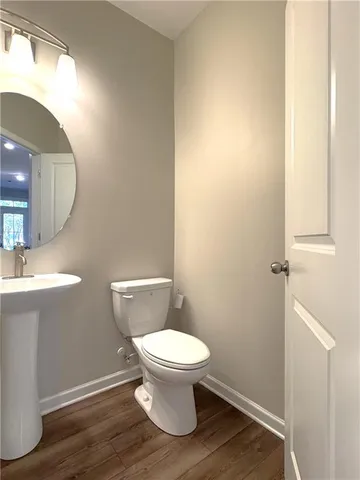 a bathroom with a toilet and a sink
