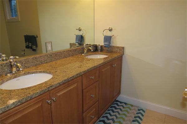14 Corn Road Bolton, MA 01740 - Photo 15 of 22 a bathroom with a granite countertop sink and a mirror