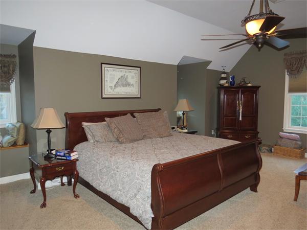 14 Corn Road Bolton, MA 01740 - Photo 16 of 22 a bedroom with bed and a chandelier