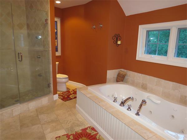 14 Corn Road Bolton, MA 01740 - Photo 17 of 22 a bathroom with a bathtub and a toilet