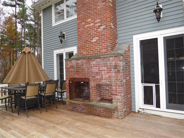 14 Corn Road Bolton, MA 01740 - Photo 19 of 22 a backyard of a house with table and chairs