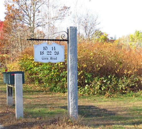 14 Corn Road Bolton, MA 01740 - Photo 22 of 22 a sign on the side of the road