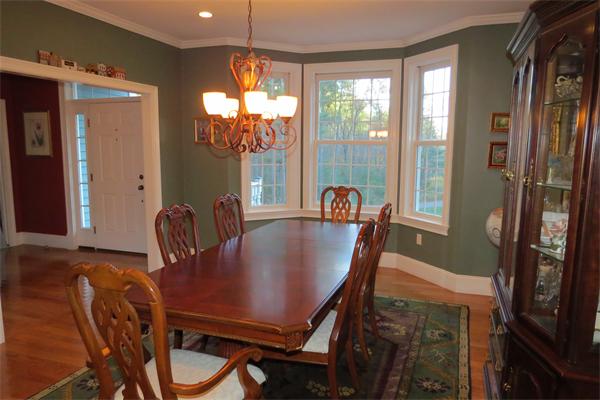 14 Corn Road Bolton, MA 01740 - Photo 4 of 22 a view of a dining room with furniture window and outside view