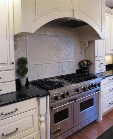14 Corn Road Bolton, MA 01740 - Photo 7 of 22 a kitchen with a stove and cabinets