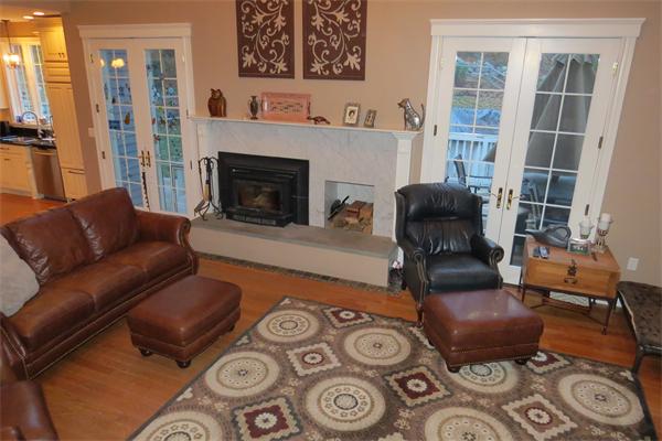 14 Corn Road Bolton, MA 01740 - Photo 10 of 22 a living room with furniture and a fireplace