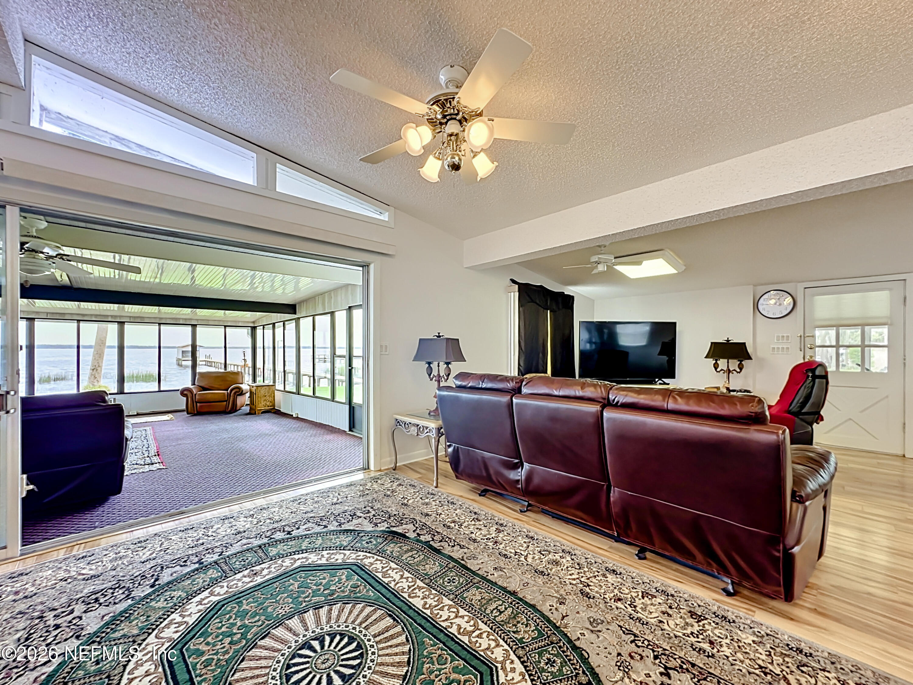 126 Pique Road Crescent City, FL 32112 - Photo 14 of 59 a living room with furniture a couch and a window