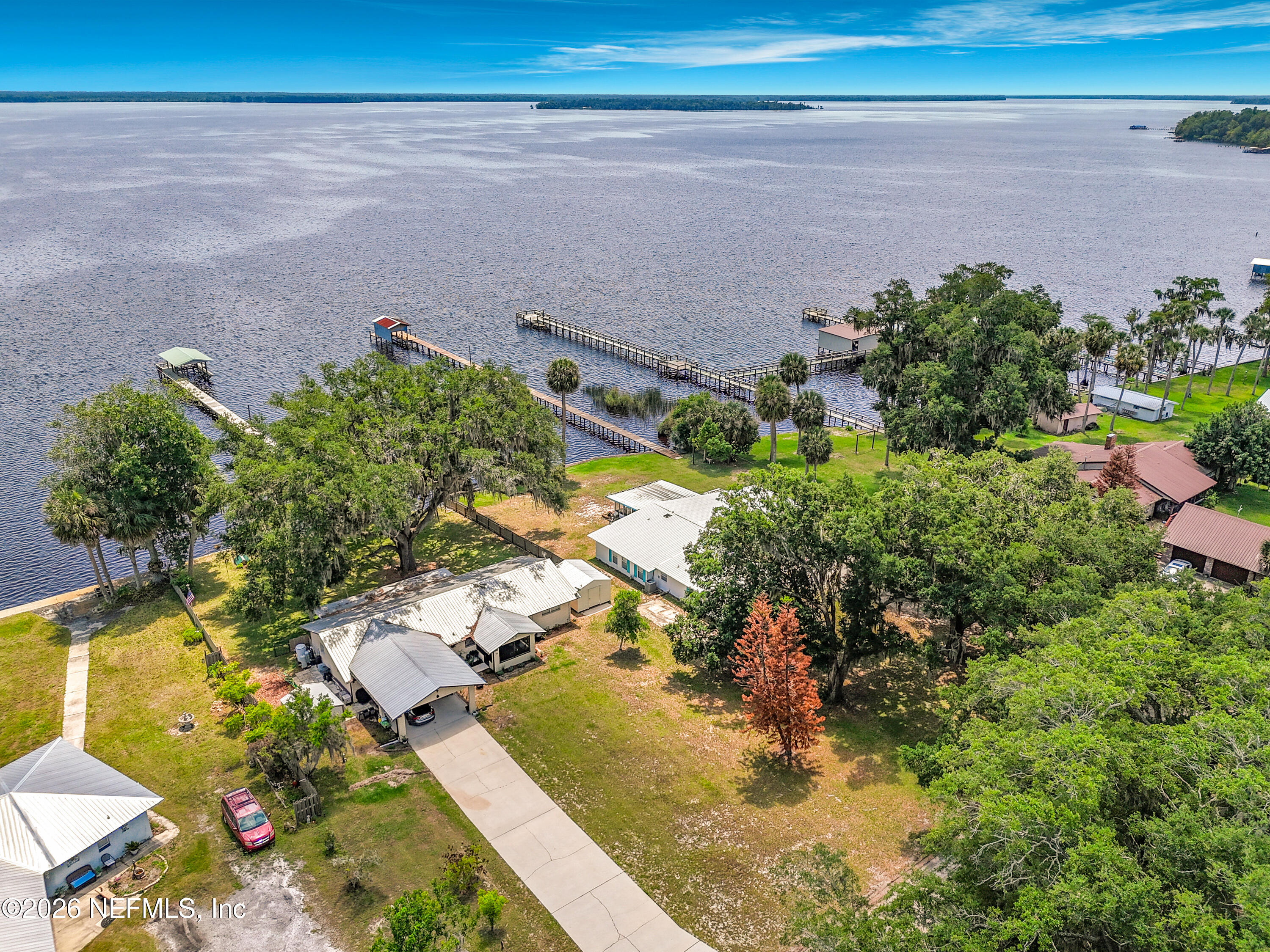 126 Pique Road Crescent City, FL 32112 - Photo 2 of 59 a view of a lake with a yard