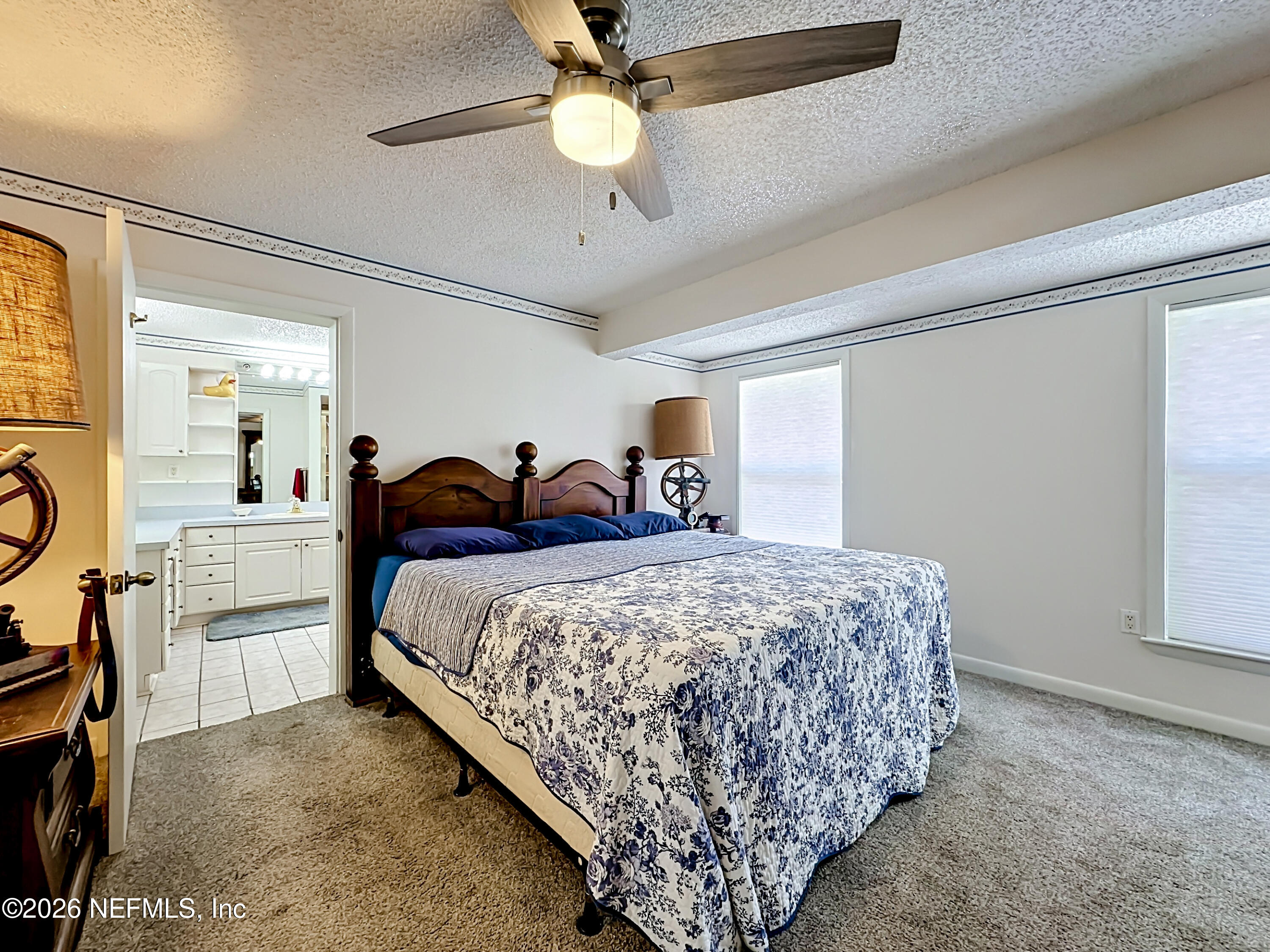 126 Pique Road Crescent City, FL 32112 - Photo 23 of 59 a bed room with a bed and a chandelier