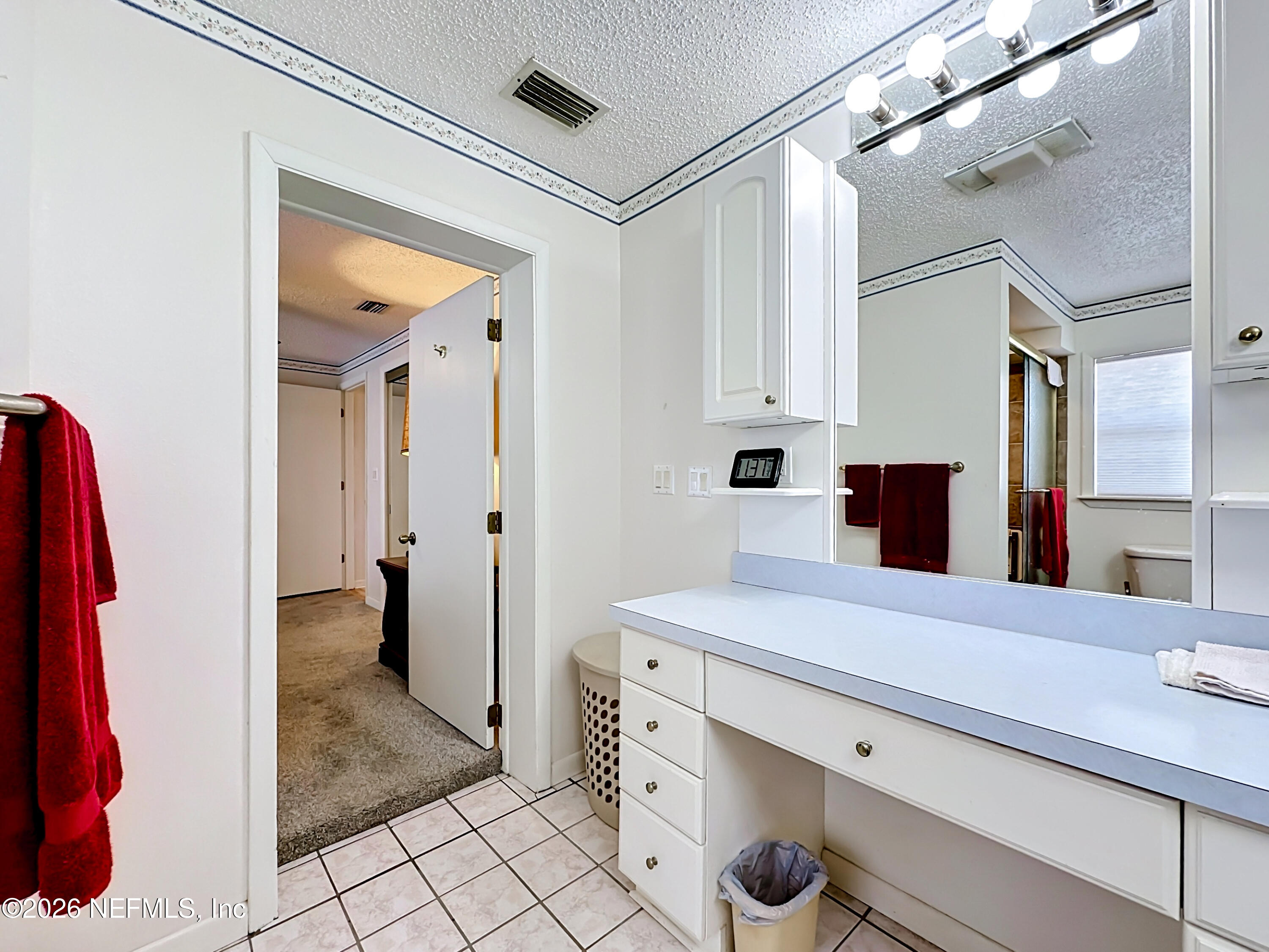126 Pique Road Crescent City, FL 32112 - Photo 28 of 59 a bathroom with a sink and a mirror