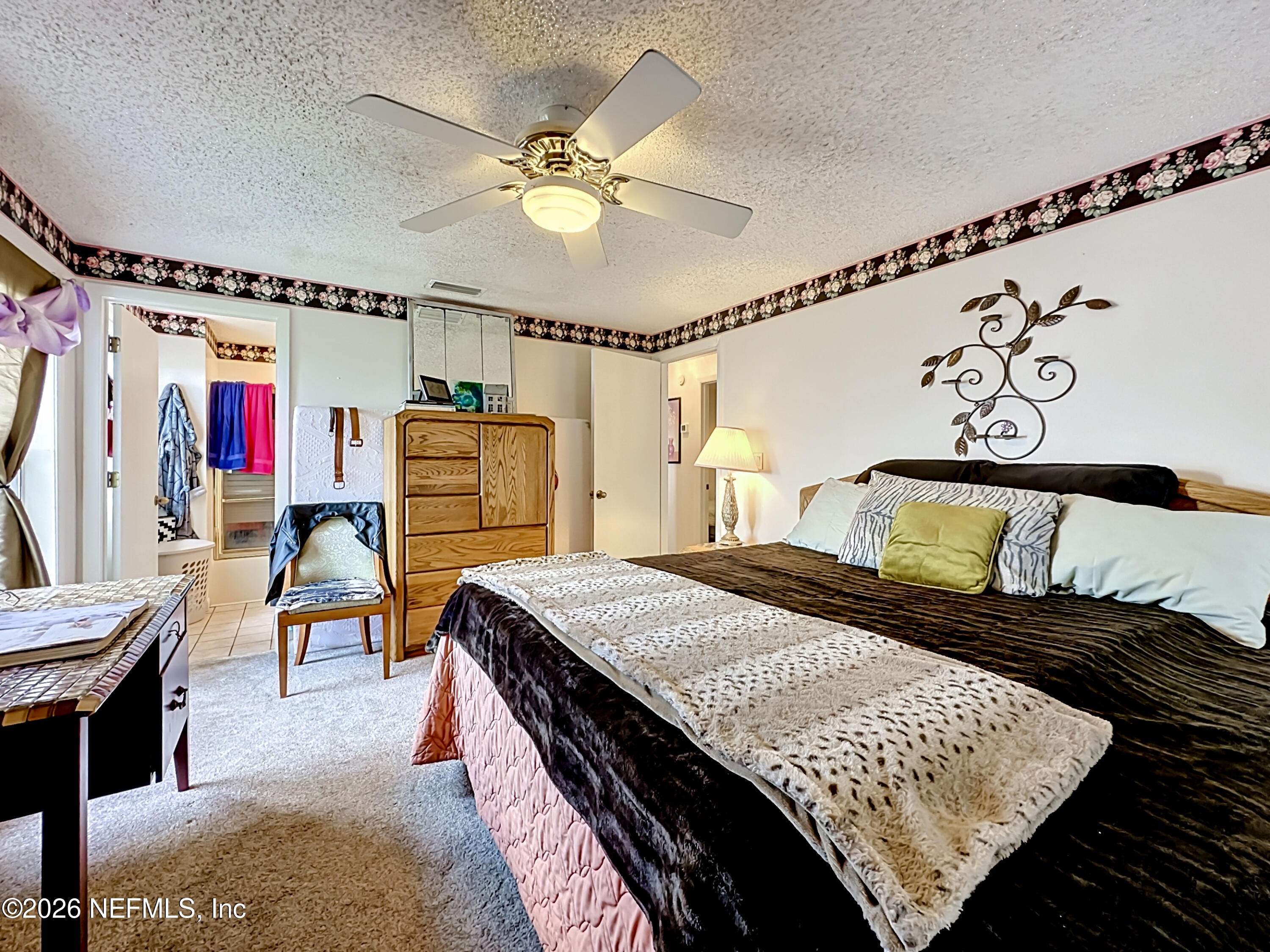 126 Pique Road Crescent City, FL 32112 - Photo 34 of 59 a bedroom with a bed a table and chair