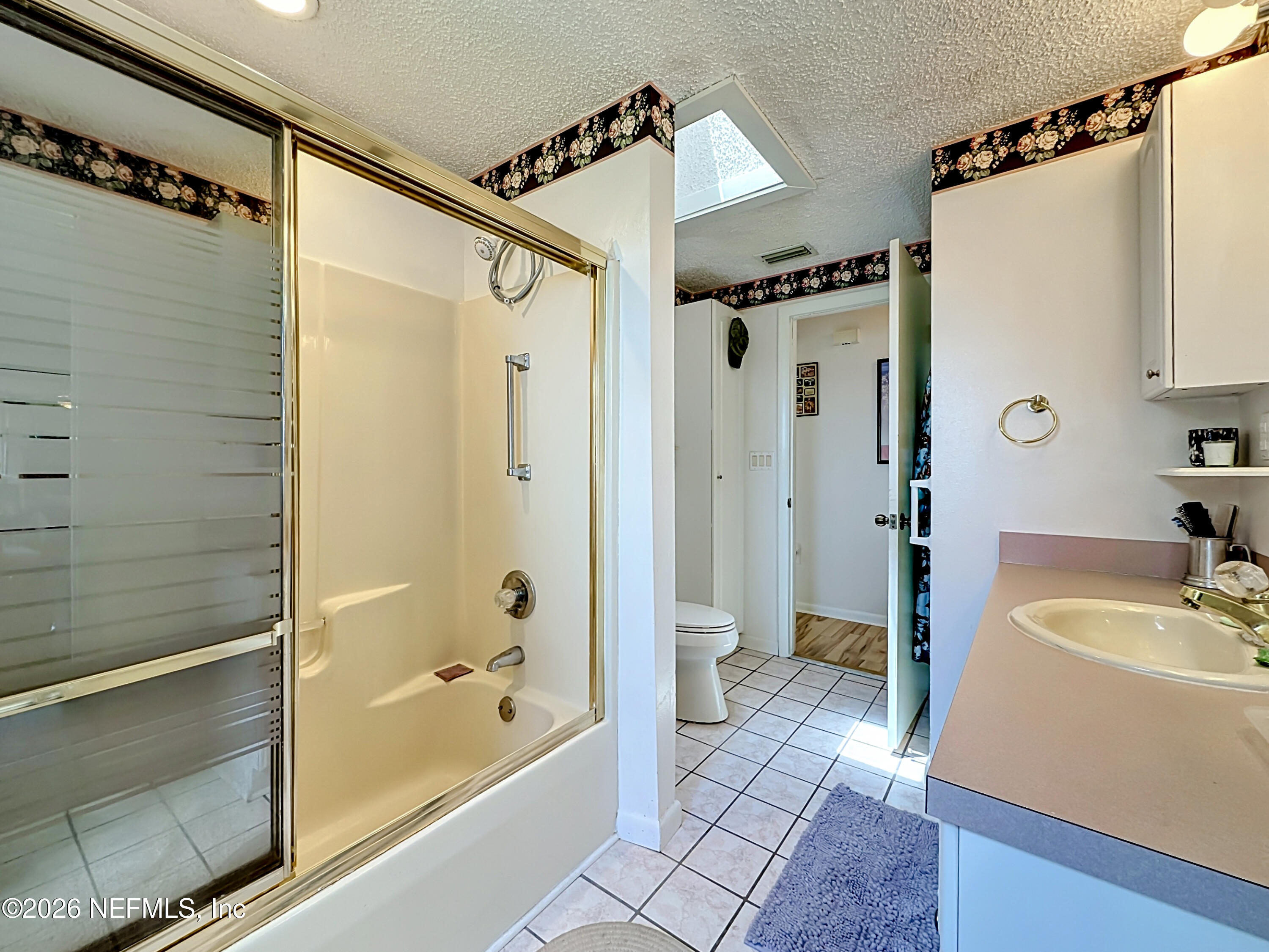 126 Pique Road Crescent City, FL 32112 - Photo 36 of 59 a bathroom with a tub a sink and a shower