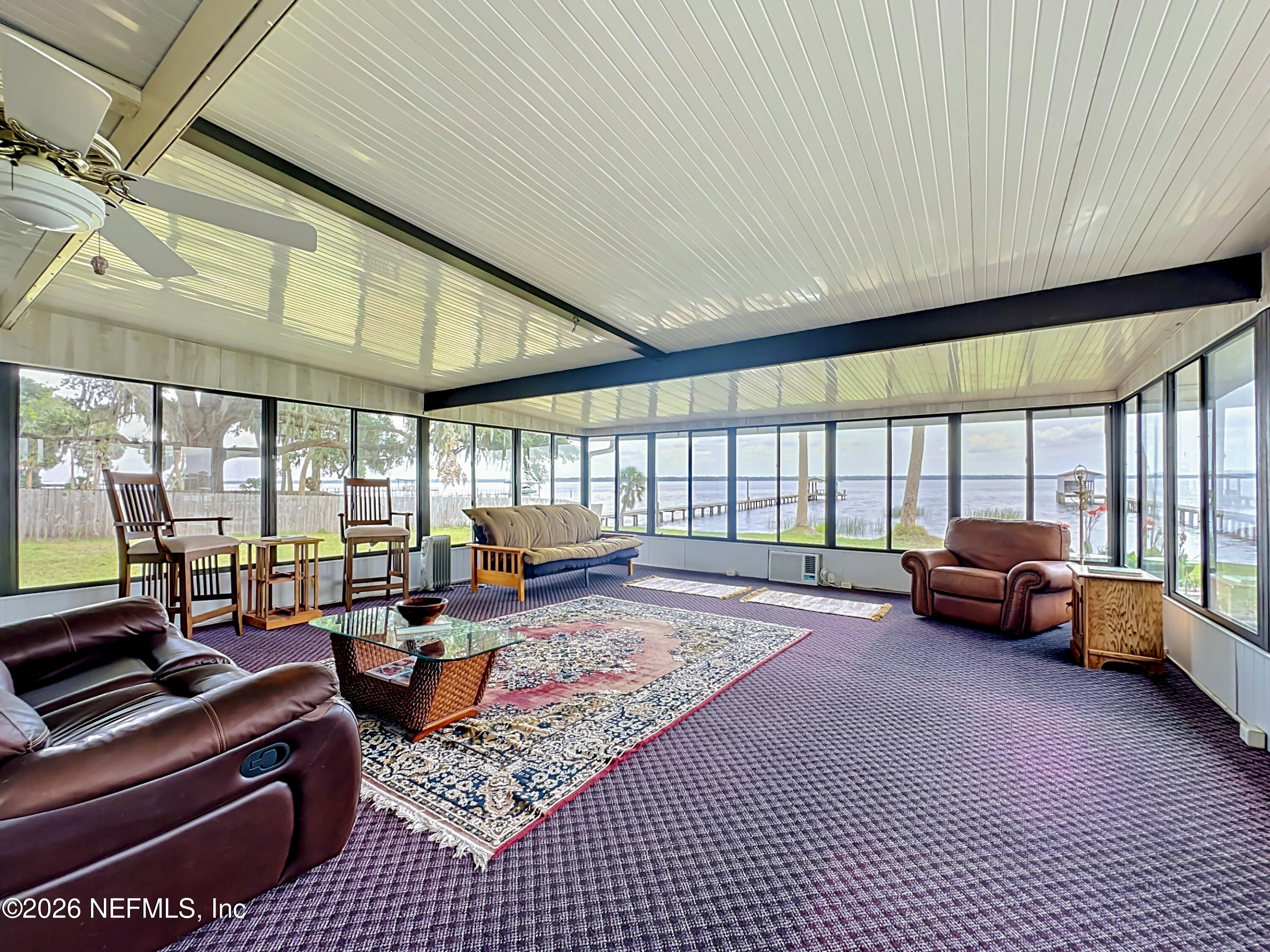 126 Pique Road Crescent City, FL 32112 - Photo 39 of 59 a living room with furniture and large windows