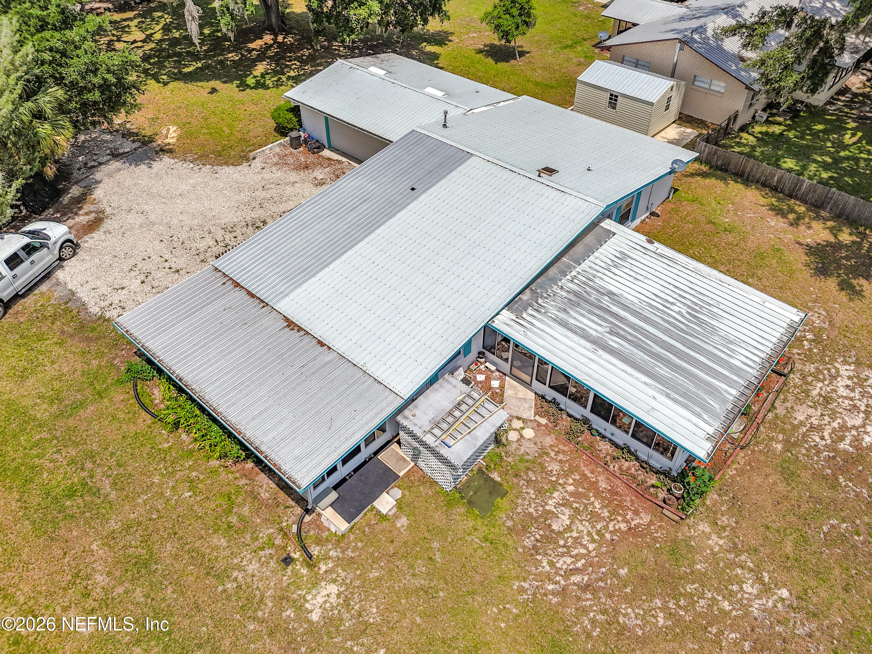 126 Pique Road Crescent City, FL 32112 - Photo 50 of 59 an aerial view of a house with a yard