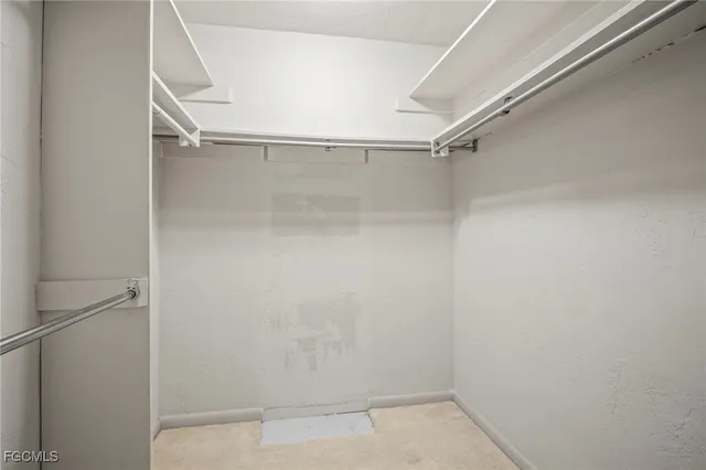 a view of an empty walk in closet